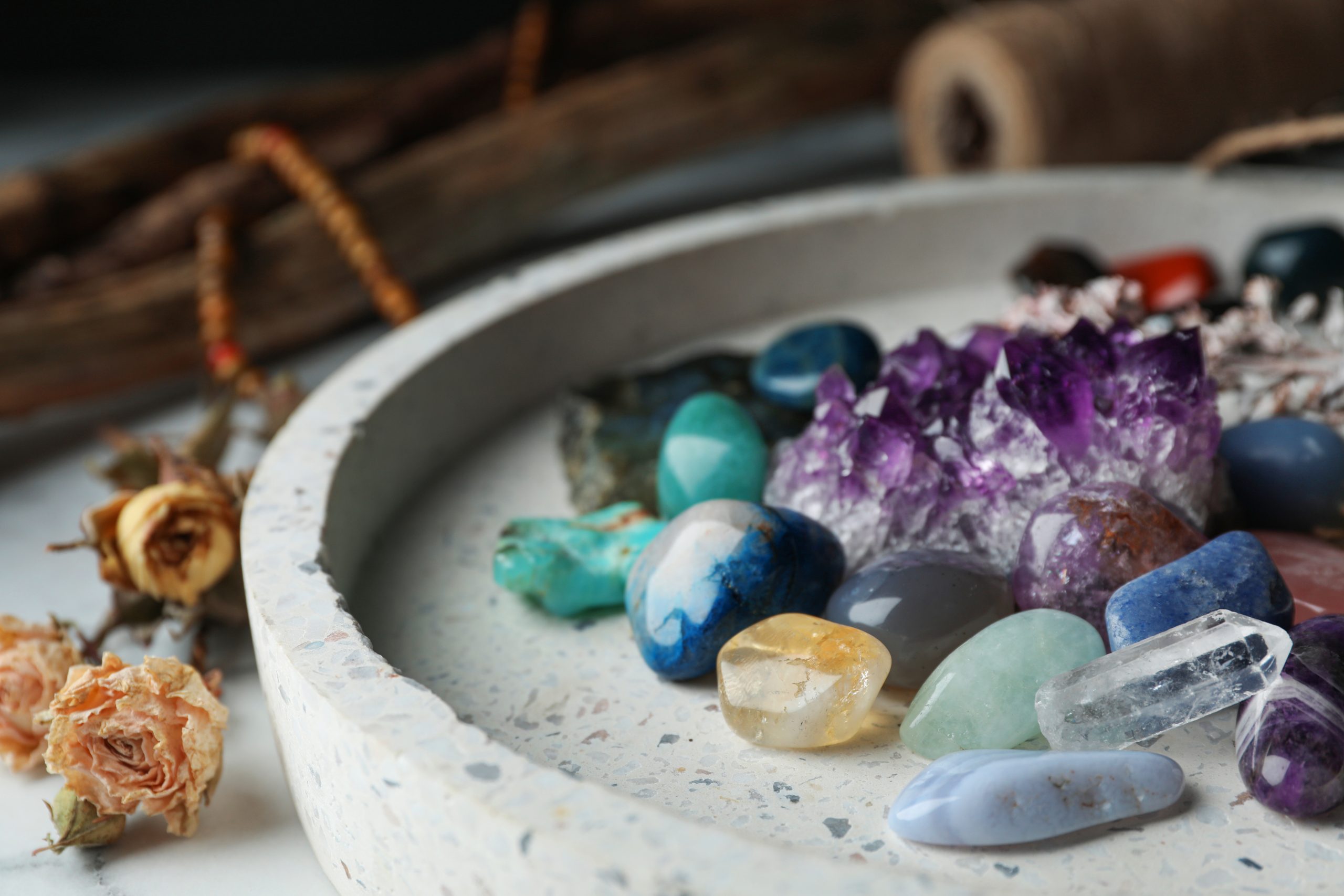 Pile of different beautiful gemstones in tray Pile of different beautiful gemstones in tray